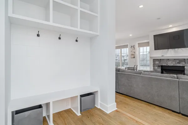 a living room with a fireplace and a flat screen tv
