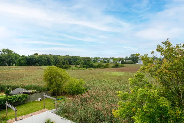 a view of lake with green space