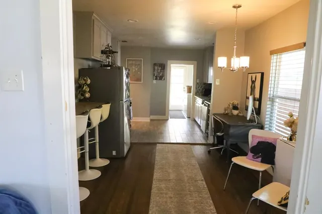 a view of a living room with furniture and a window
