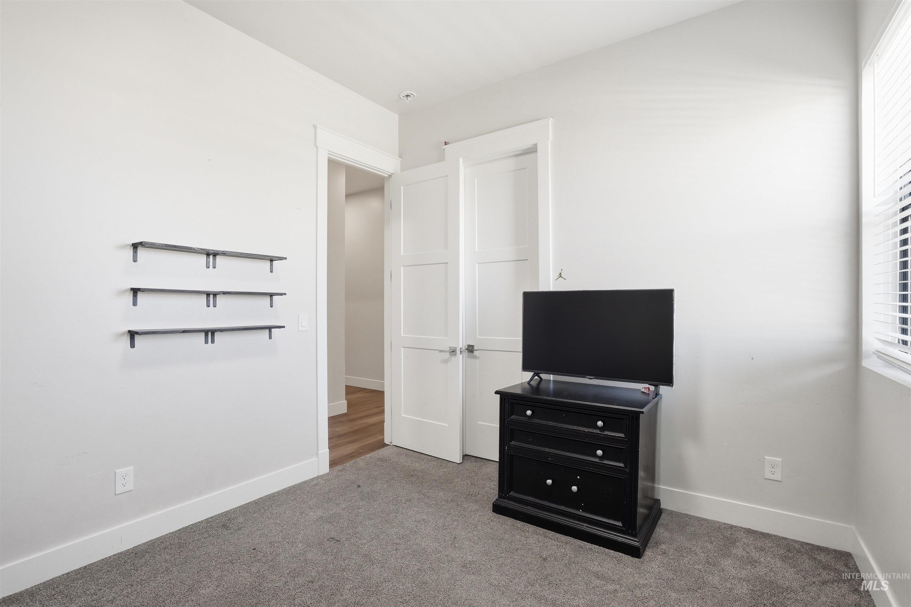 320 West Homedale Road Caldwell, ID 83607 - Photo 20 of 48 Unfurnished bedroom with carpet and baseboards