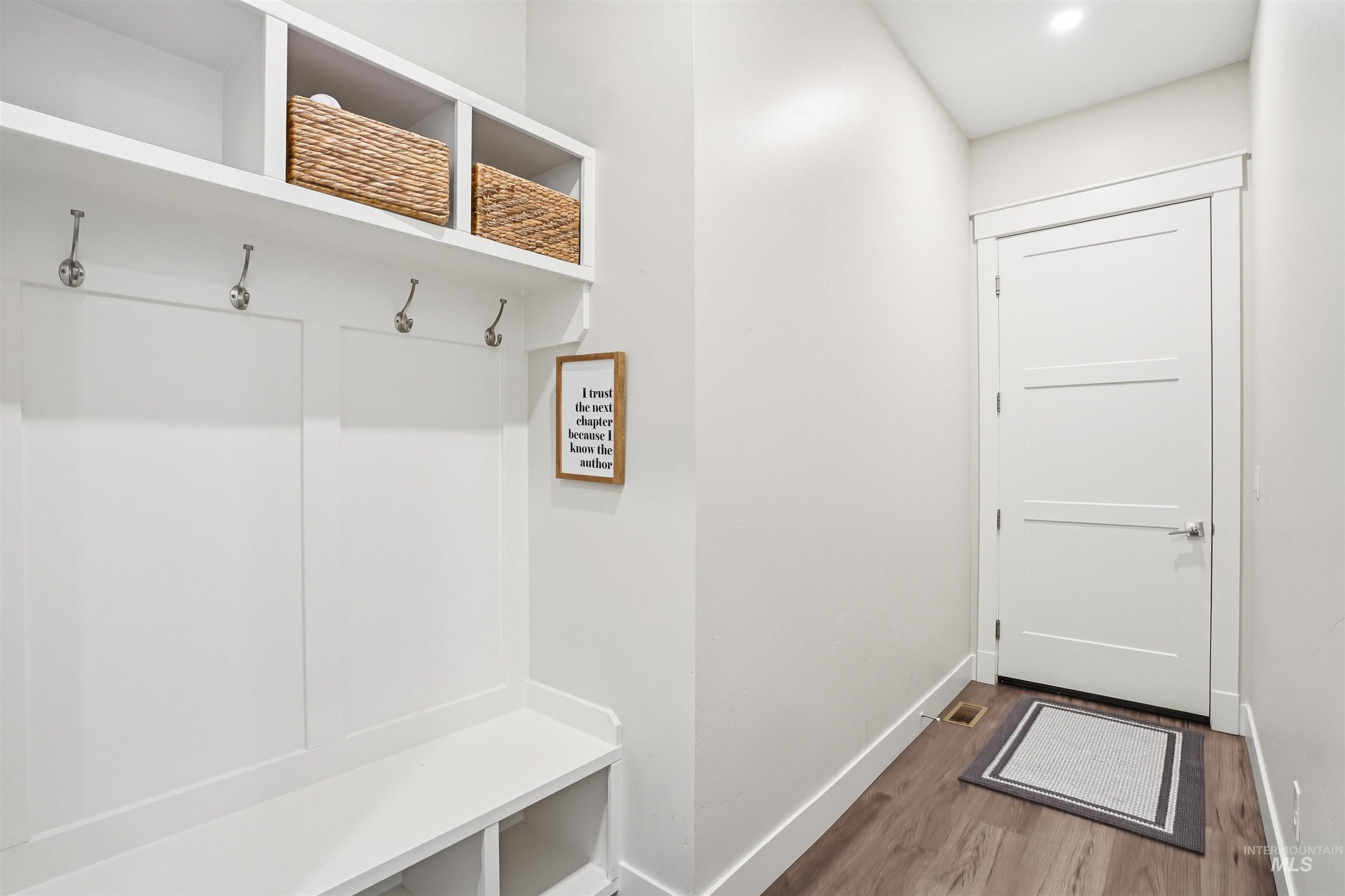 320 West Homedale Road Caldwell, ID 83607 - Photo 22 of 48 Mudroom with dark wood-style floors and baseboards