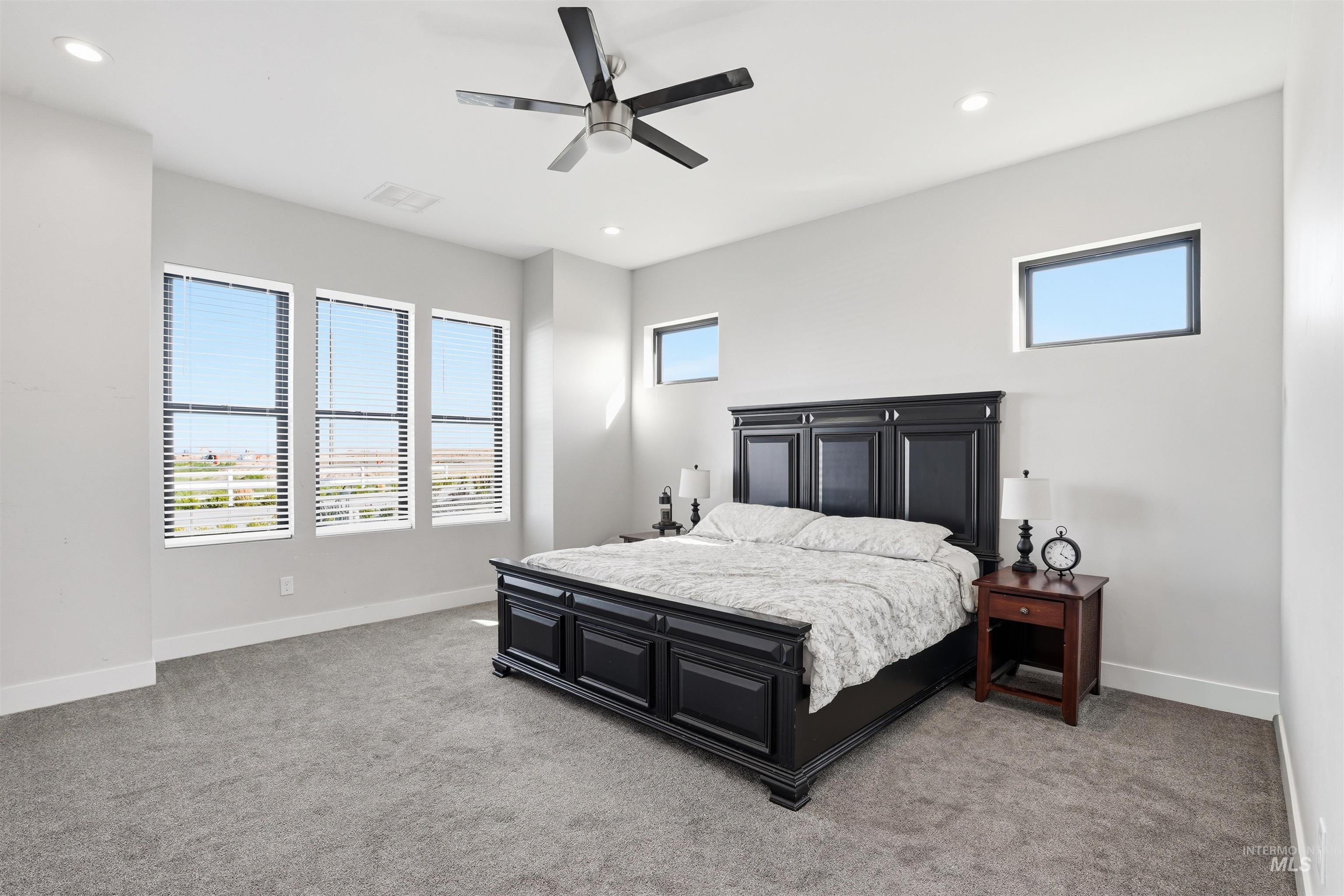 320 West Homedale Road Caldwell, ID 83607 - Photo 26 of 48 Bedroom featuring a ceiling fan, light carpet, and recessed lighting