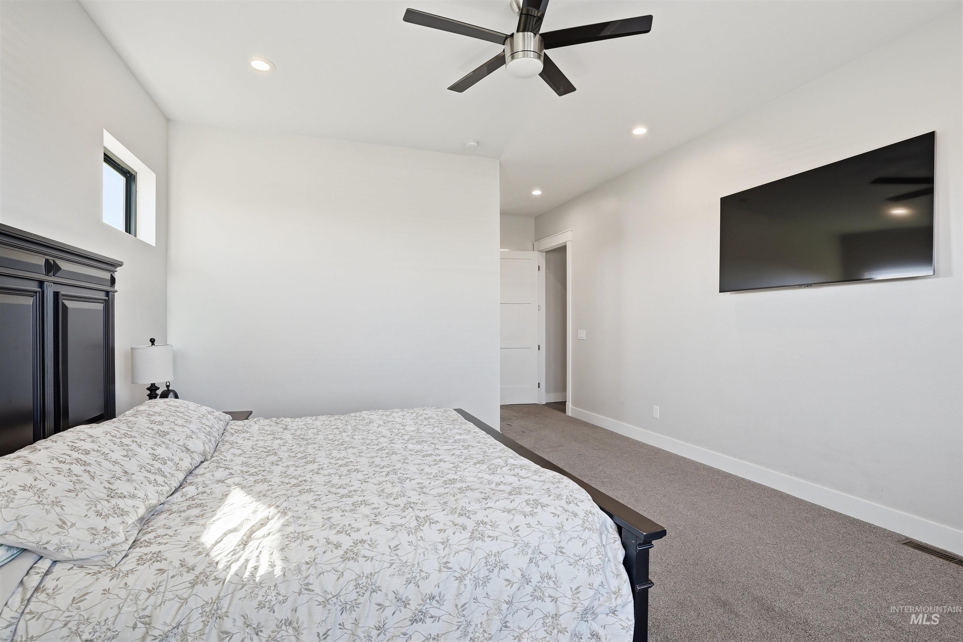 320 West Homedale Road Caldwell, ID 83607 - Photo 27 of 48 Bedroom featuring ceiling fan, carpet flooring, and recessed lighting