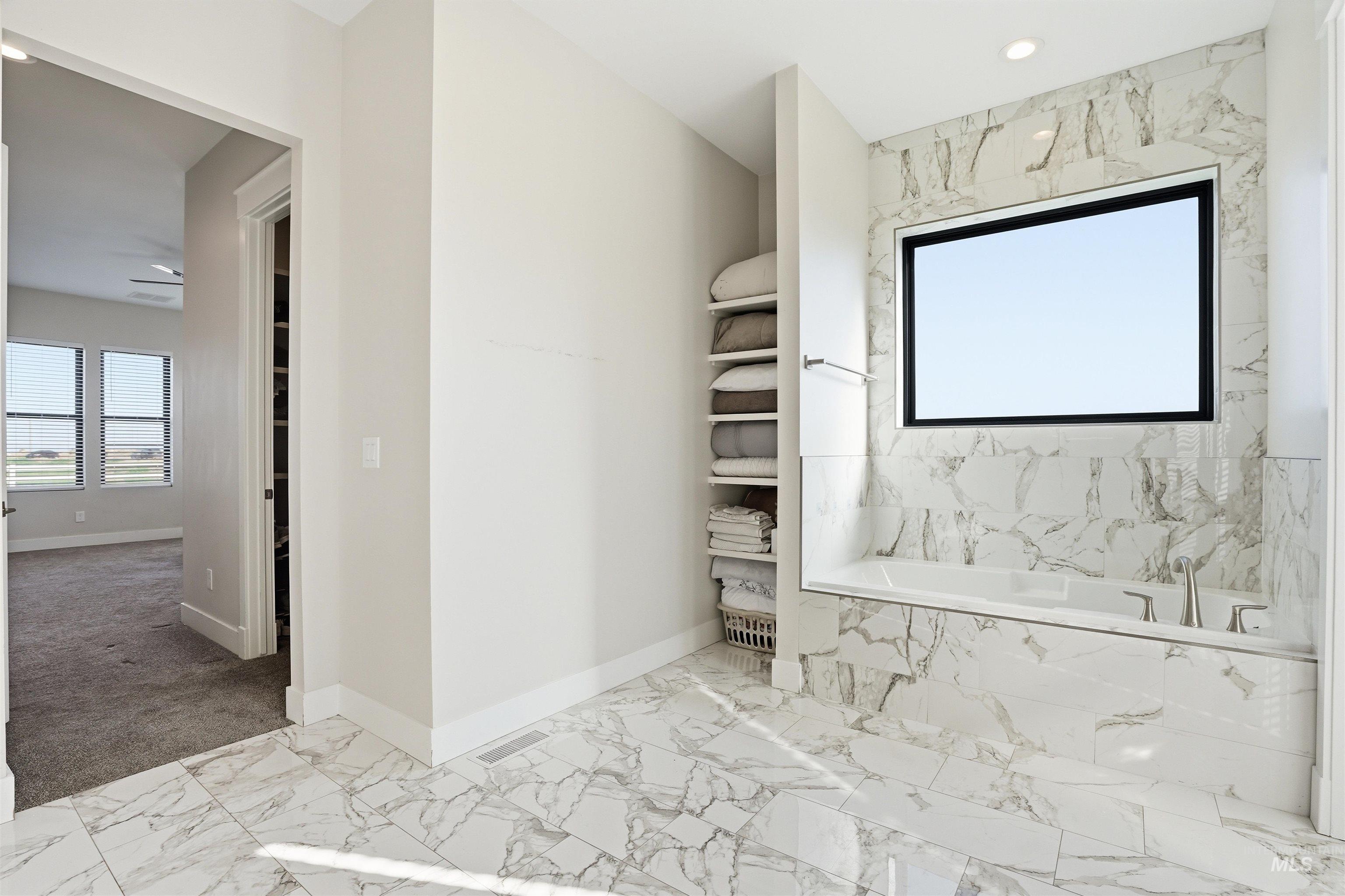 320 West Homedale Road Caldwell, ID 83607 - Photo 30 of 48 Full bathroom with light marble finish flooring, a garden tub, and recessed lighting