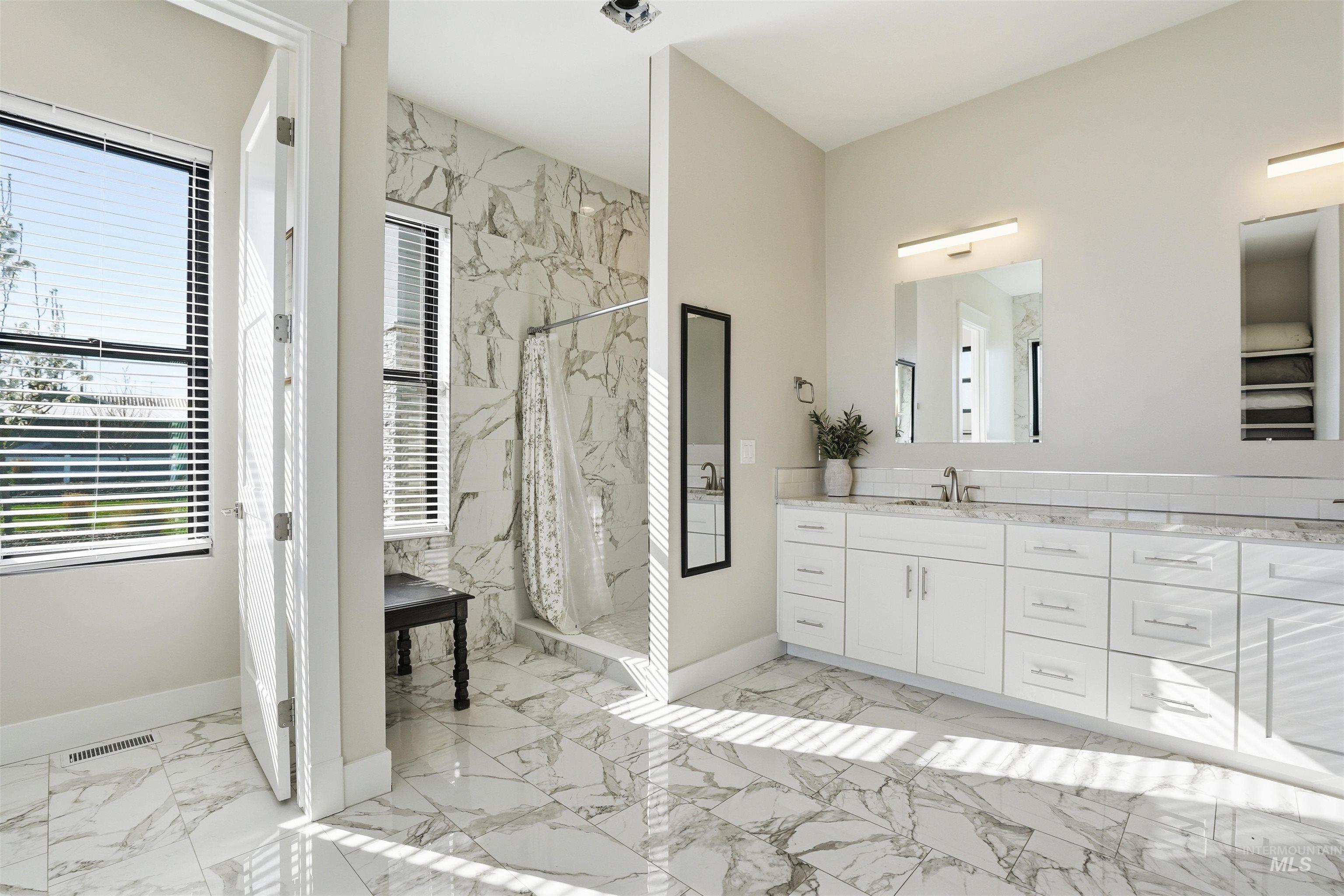 320 West Homedale Road Caldwell, ID 83607 - Photo 31 of 48 Bathroom with vanity, a marble finish shower, and light marble finish flooring