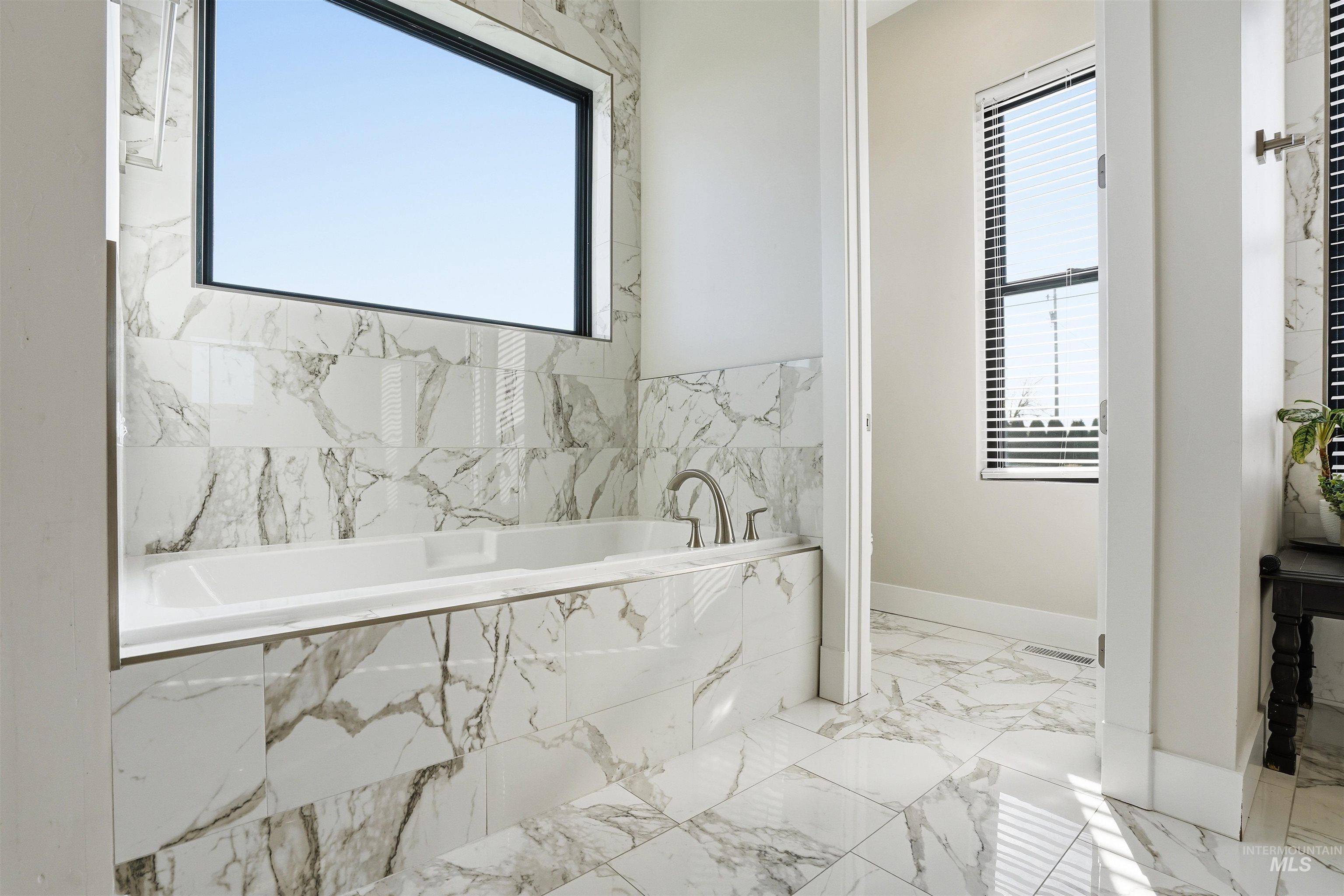 320 West Homedale Road Caldwell, ID 83607 - Photo 33 of 48 Full bathroom with a garden tub and light marble finish flooring