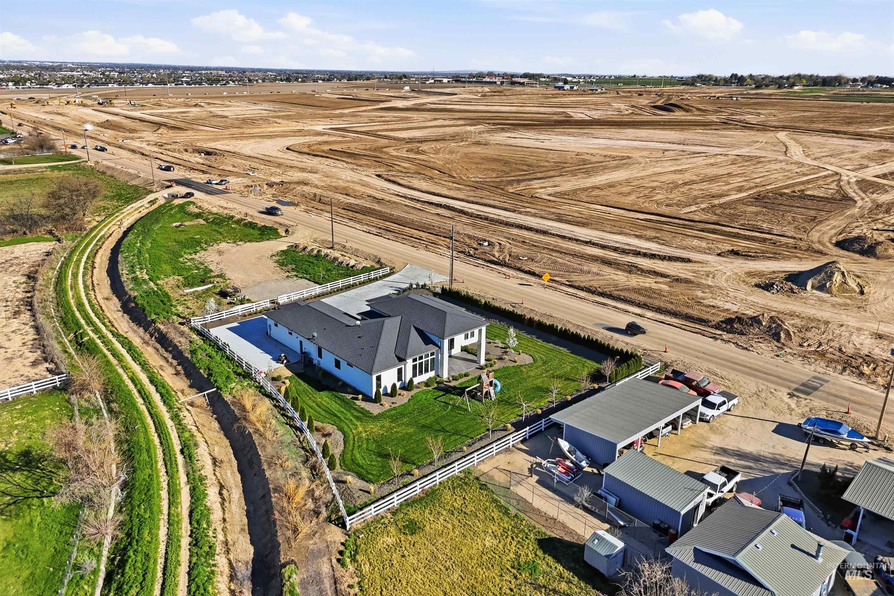 320 West Homedale Road Caldwell, ID 83607 - Photo 40 of 48 Aerial view of property and surrounding area with rural landscape