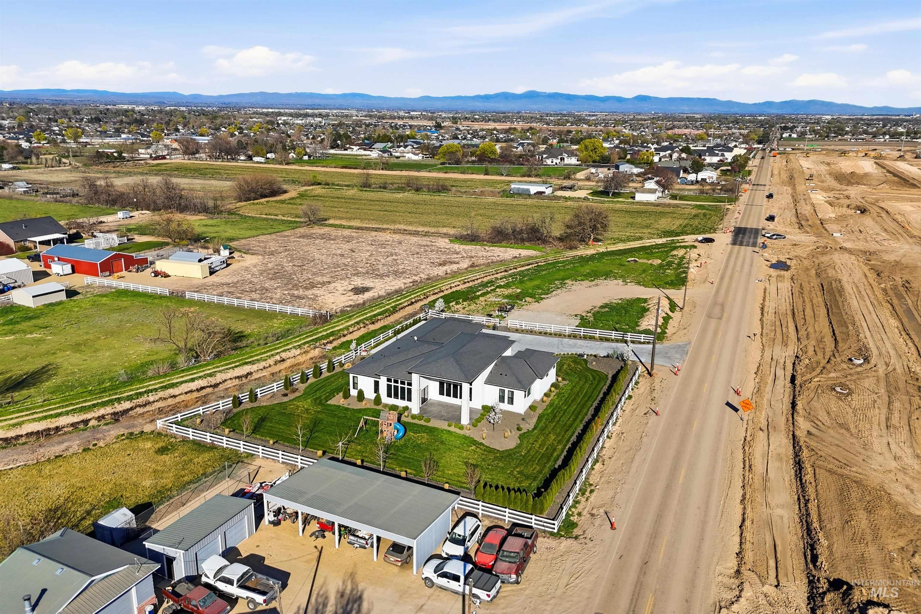 320 West Homedale Road Caldwell, ID 83607 - Photo 41 of 48 View of property location with a mountainous background and nearby suburban area