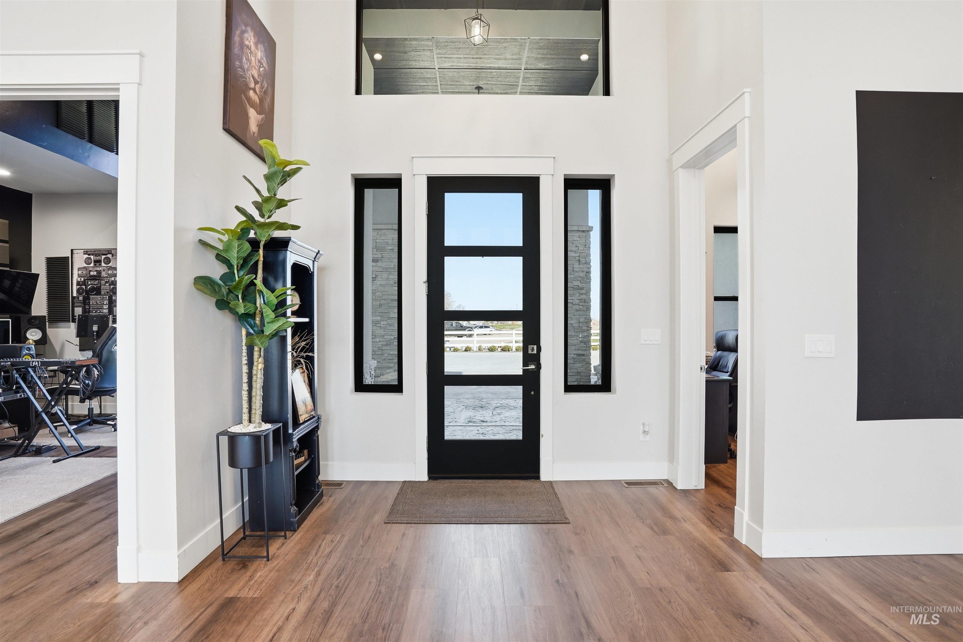 320 West Homedale Road Caldwell, ID 83607 - Photo 9 of 48 Foyer with a high ceiling and wood finished floors