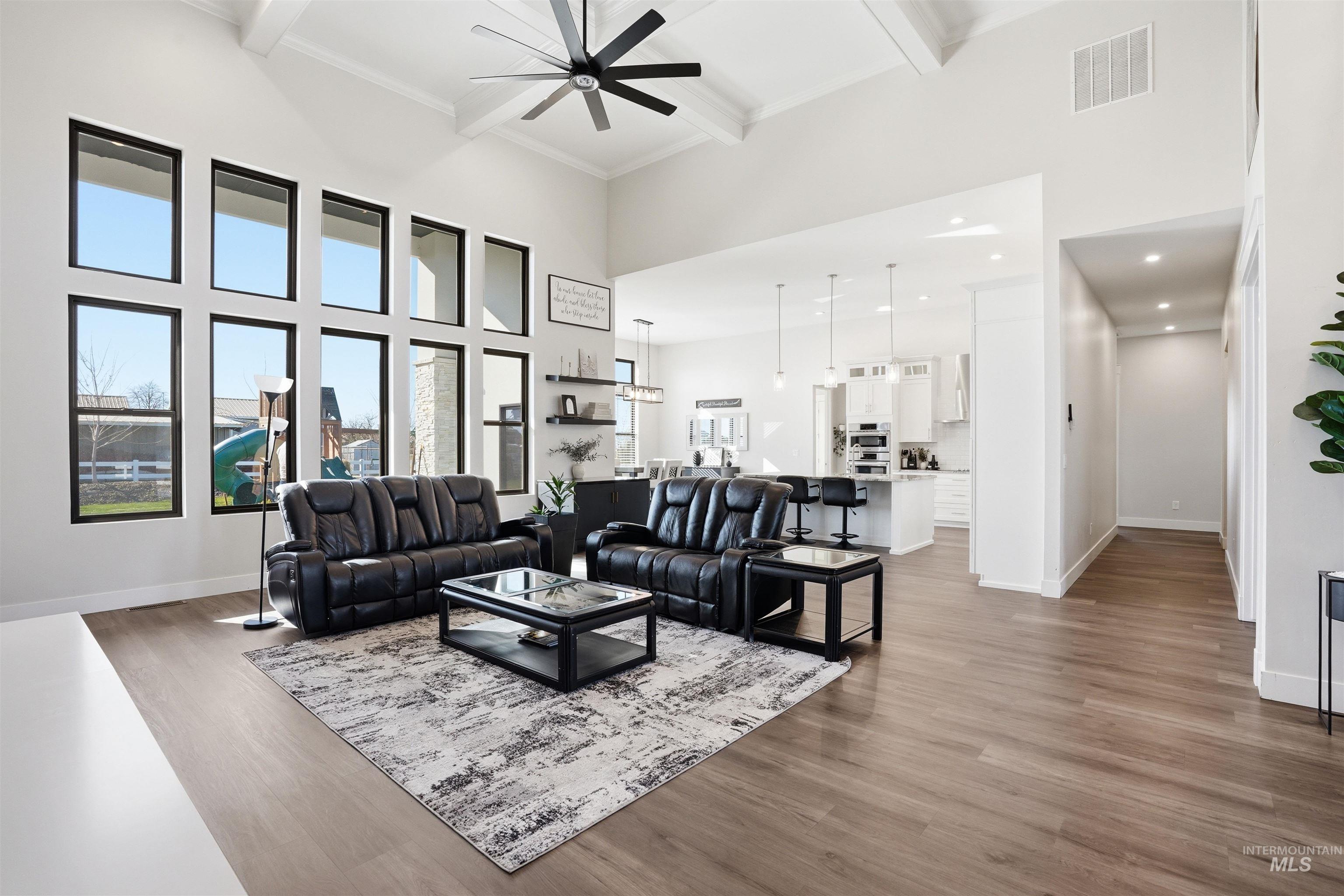 320 West Homedale Road Caldwell, ID 83607 - Photo 10 of 48 Living room with dark wood finished floors and ceiling fan