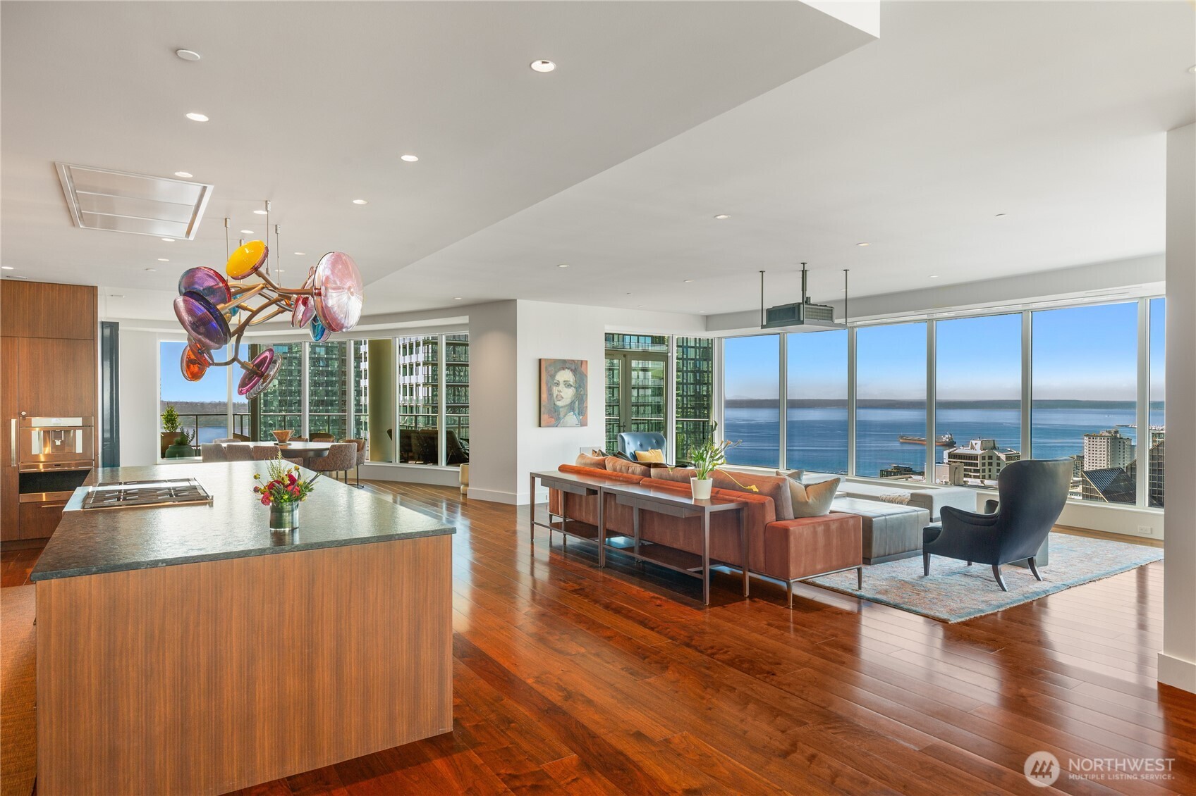 1920 4th Avenue, Unit PH101 Seattle, WA 98101 - Photo 2 of 40 a living room with furniture and a large window