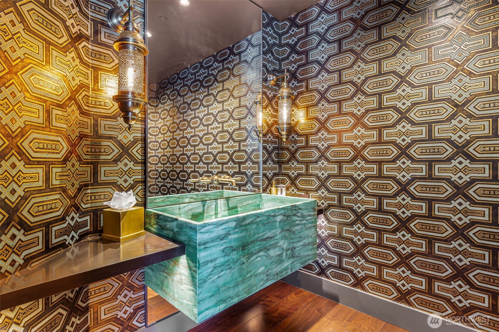 1920 4th Avenue, Unit PH101 Seattle, WA 98101 - Photo 23 of 40 a bathroom with a sink and a blue shower curtain