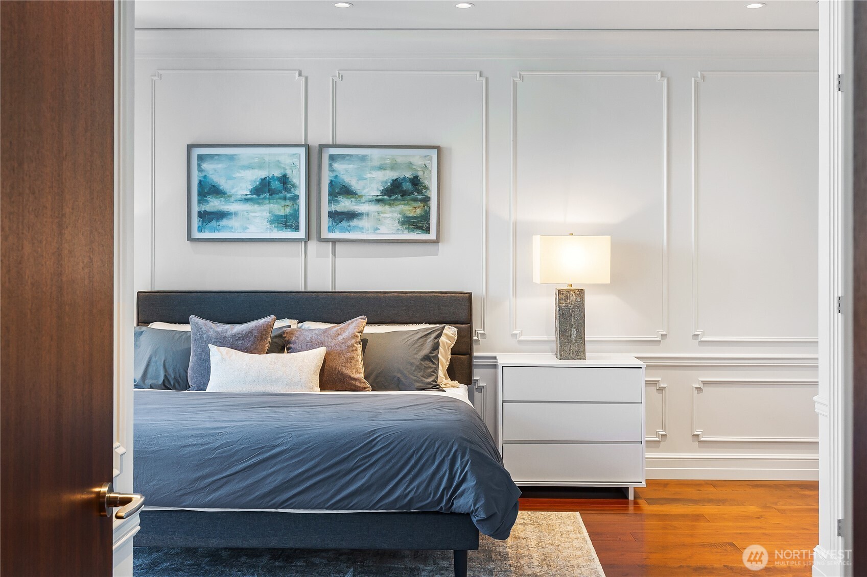 1920 4th Avenue, Unit PH101 Seattle, WA 98101 - Photo 24 of 40 a bedroom with a bed and a painting on the wall