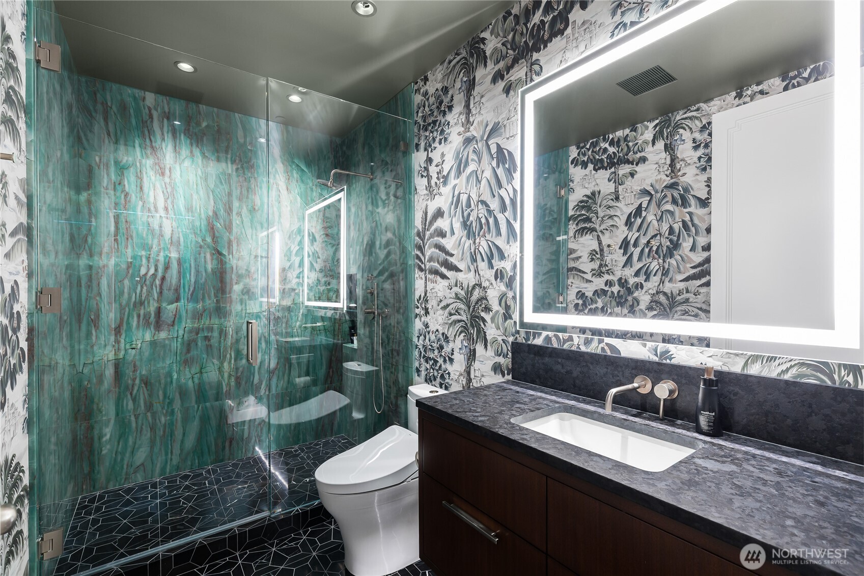 1920 4th Avenue, Unit PH101 Seattle, WA 98101 - Photo 28 of 40 a bathroom with a granite countertop sink toilet and shower