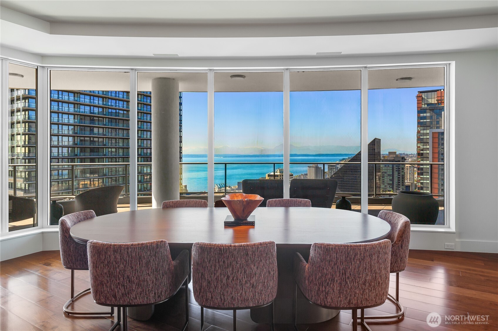 1920 4th Avenue, Unit PH101 Seattle, WA 98101 - Photo 32 of 40 a dining room with furniture and wooden floor