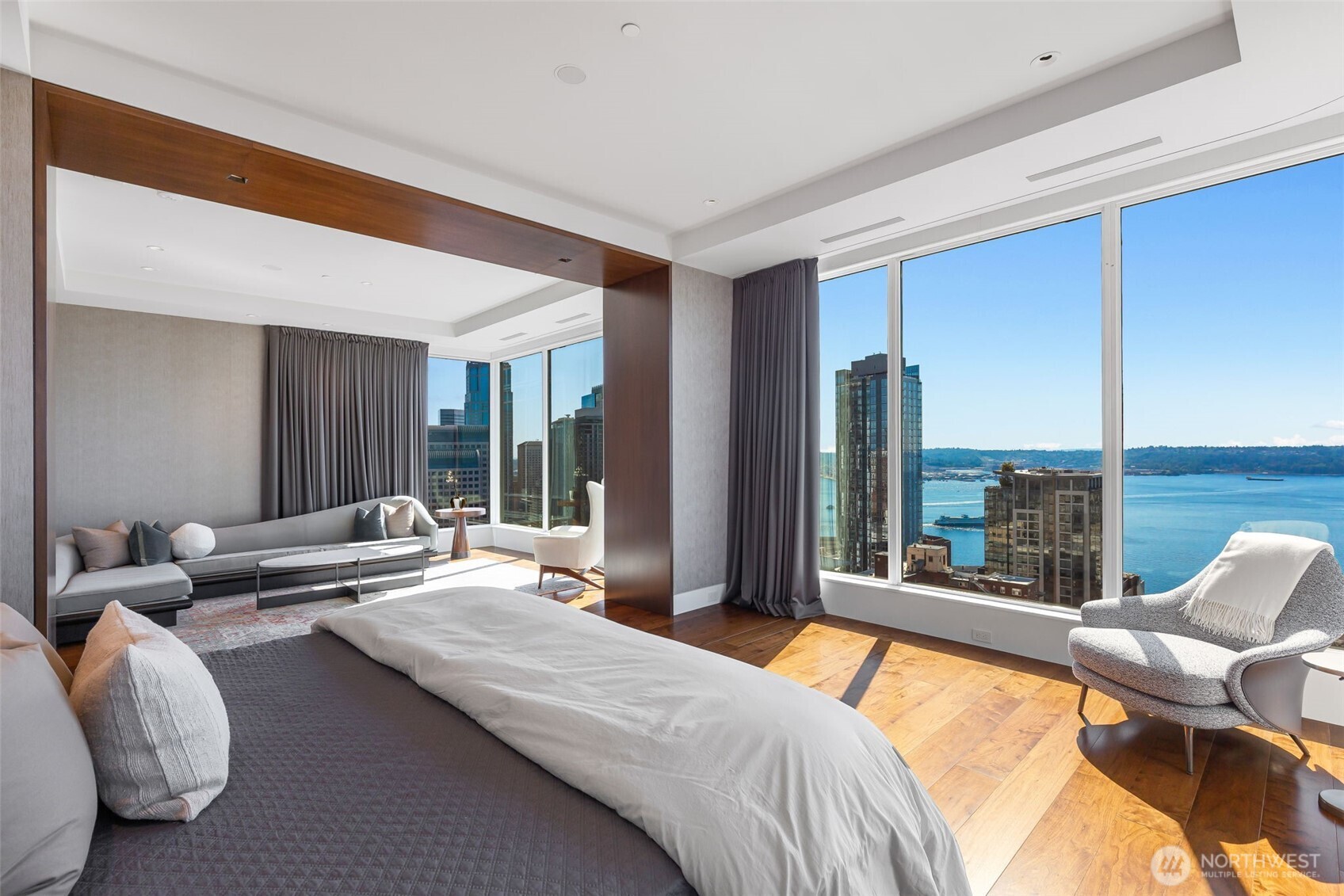 1920 4th Avenue, Unit PH101 Seattle, WA 98101 - Photo 35 of 40 a bedroom with furniture and large windows