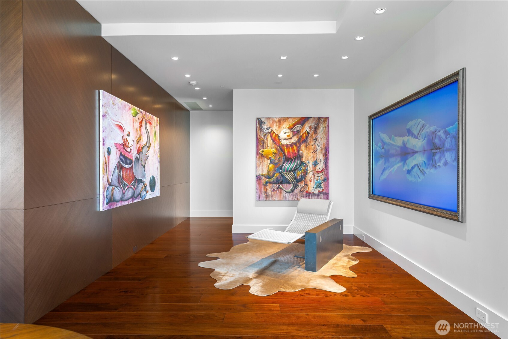 1920 4th Avenue, Unit PH101 Seattle, WA 98101 - Photo 8 of 40 a living room with furniture wall painting and wooden floor