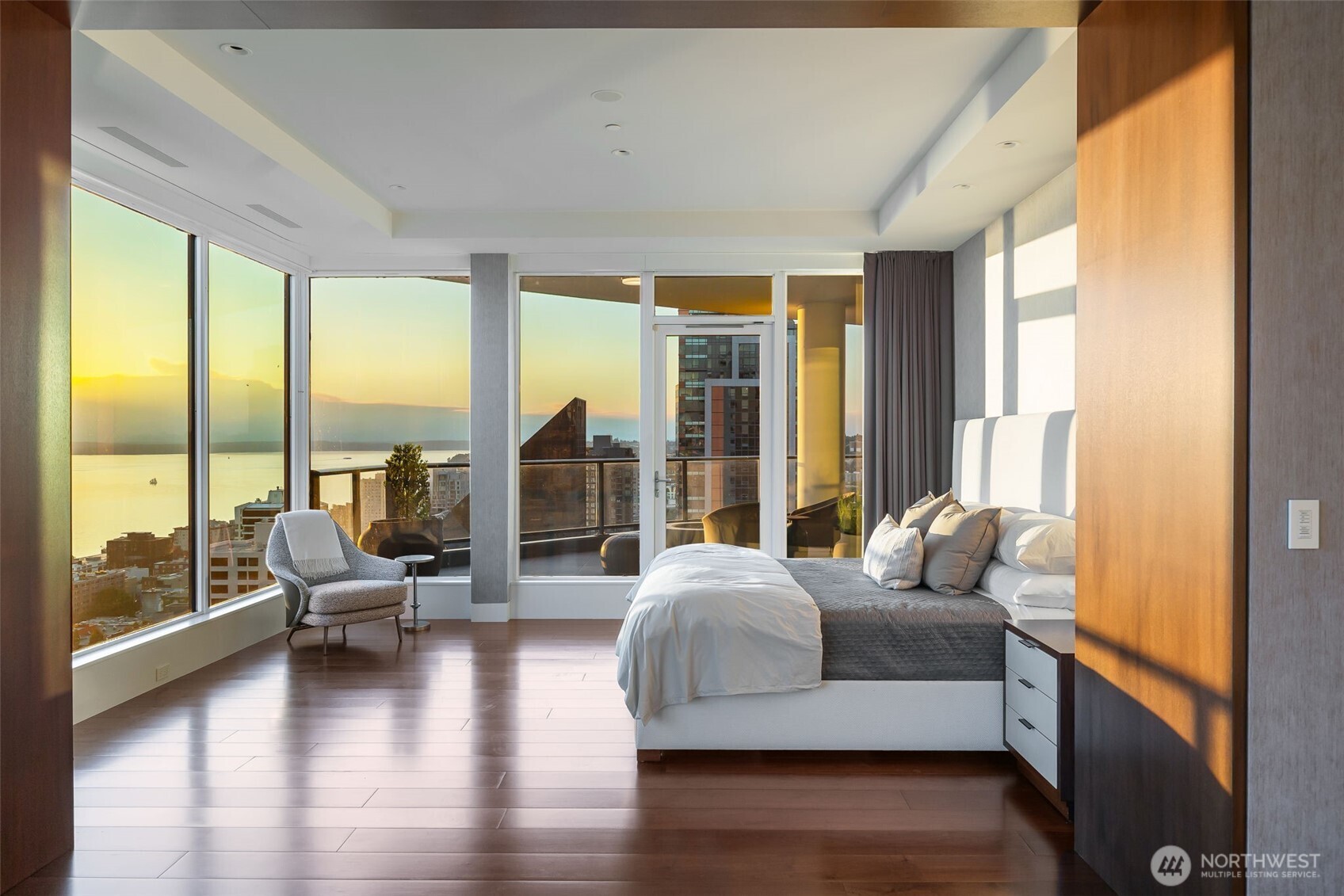 1920 4th Avenue, Unit PH101 Seattle, WA 98101 - Photo 9 of 40 a living room with furniture and a large window