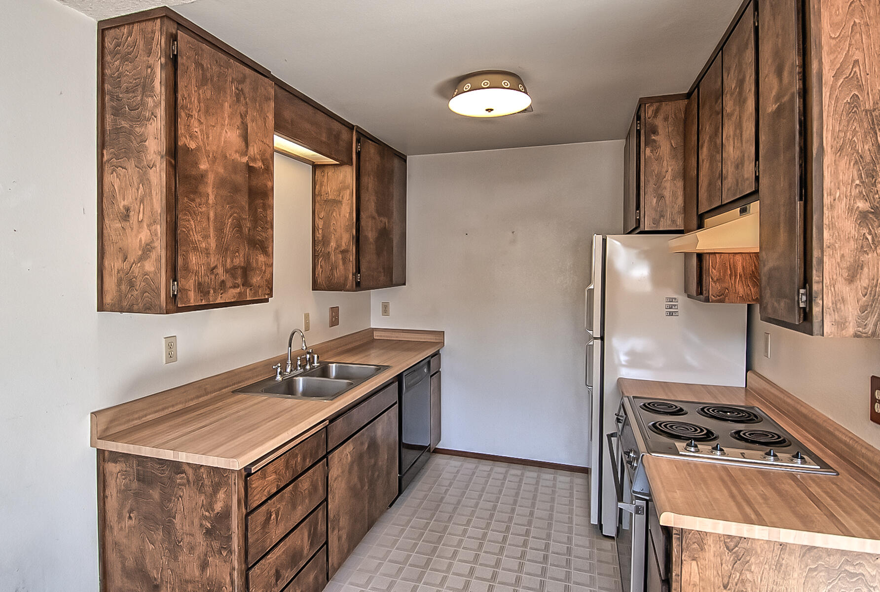 4597 Cedars Road Redding, CA 96001 - Photo 5 of 18 a kitchen with a stove and a sink