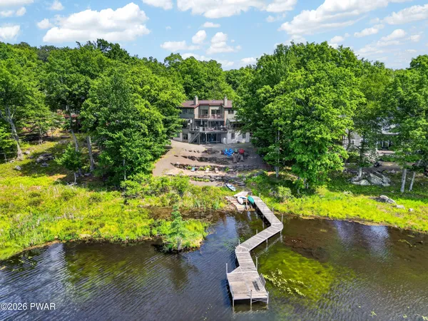 a view of a lake with a house in the background