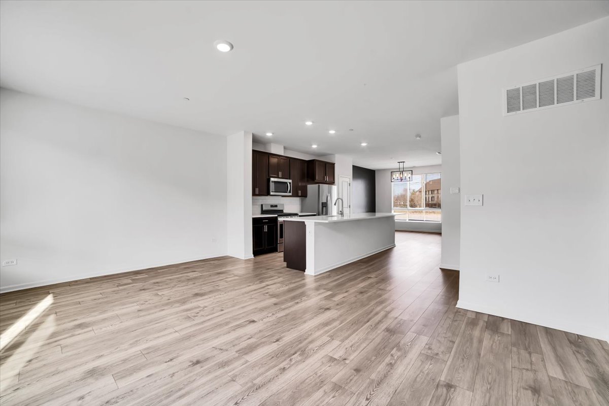1292 Quadrant Lane Schaumburg, IL 60173 - Photo 11 of 39 a view of kitchen with wooden floor
