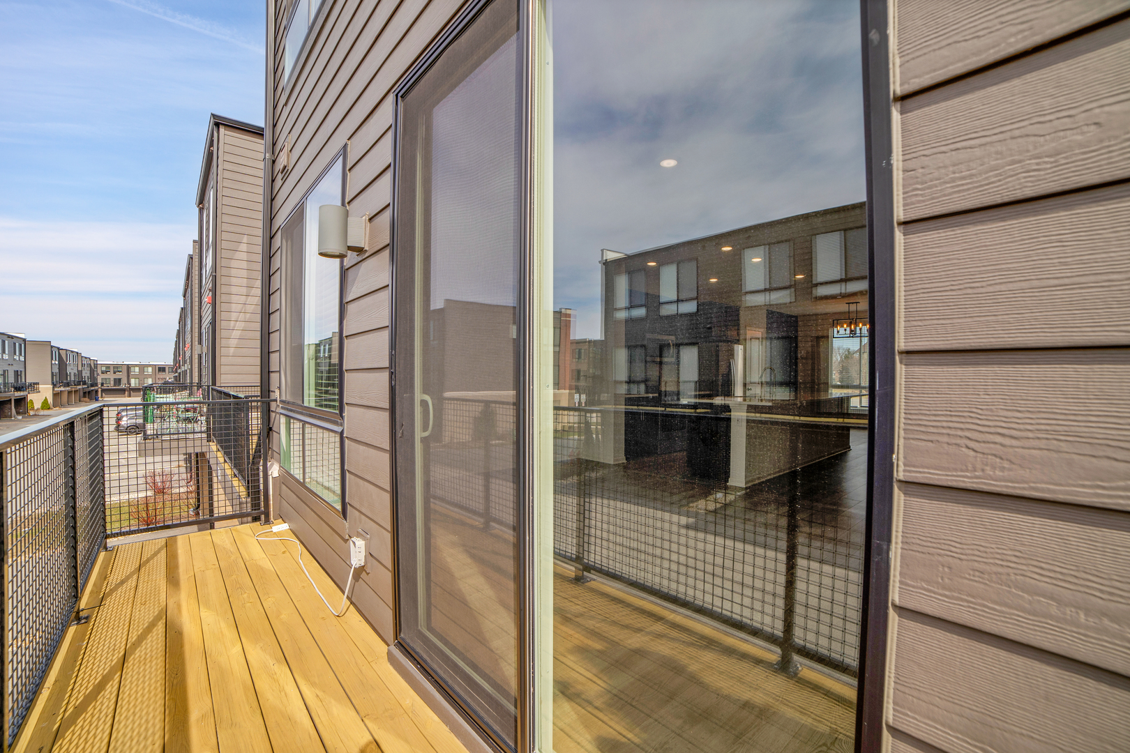 1292 Quadrant Lane Schaumburg, IL 60173 - Photo 13 of 39 a view of a balcony with wooden floor and door