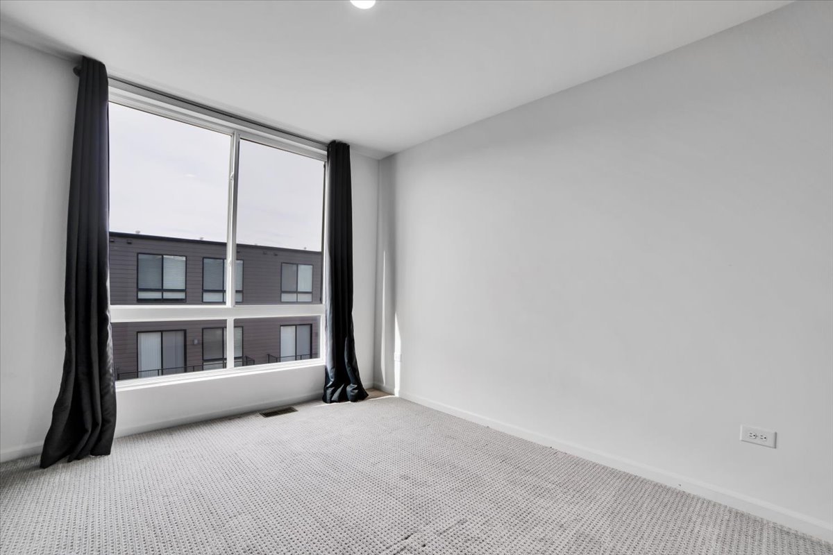 1292 Quadrant Lane Schaumburg, IL 60173 - Photo 17 of 39 a view of an empty room with a window