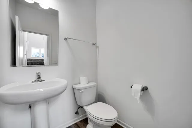 a view of an entryway with wooden floor