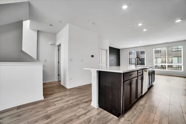 a kitchen with stainless steel appliances a stove top oven and a refrigerator