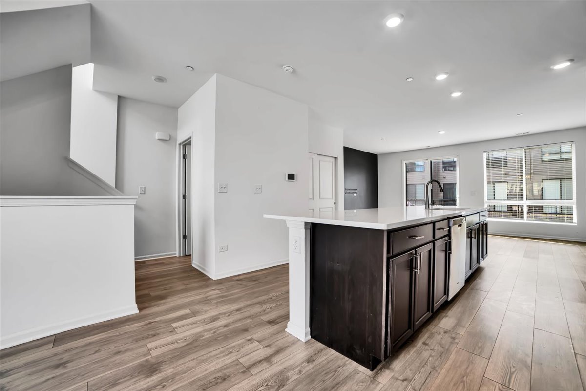 1292 Quadrant Lane Schaumburg, IL 60173 - Photo 7 of 39 a kitchen with stainless steel appliances a stove top oven and a refrigerator