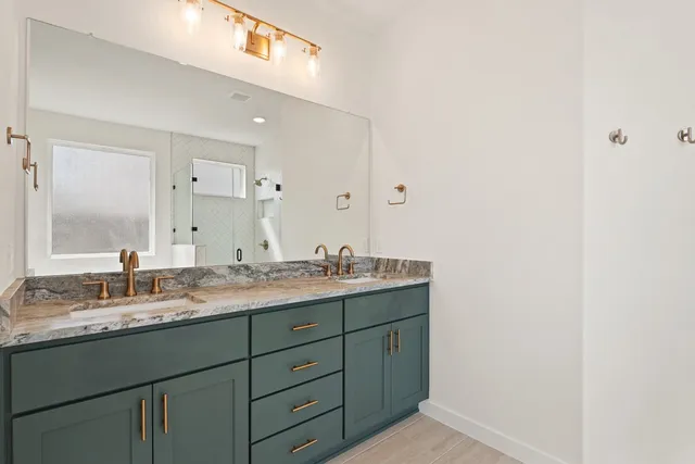 a bathroom with a tub and a shower