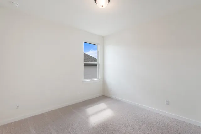 a bathroom with a white toilet and a shower