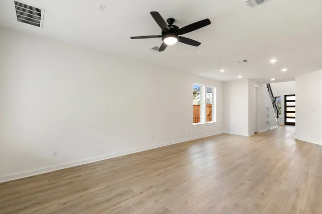 a view of a kitchen with a sink and refrigerator