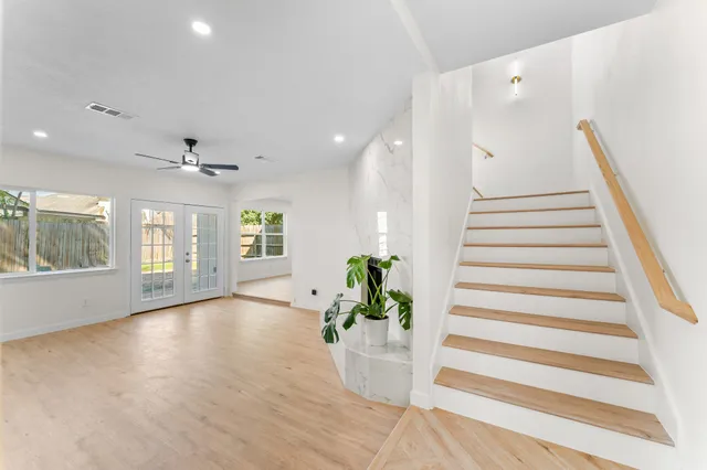 a view of an entryway with wooden floor and windows