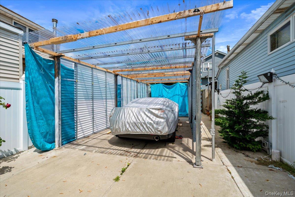 102-16 164th Road Queens, NY 11414 - Photo 4 of 29 driveway - car port