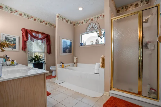 a bathroom with a sink a mirror and a shower