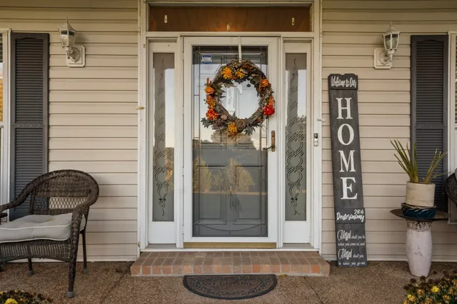a front view of a house with outdoor seating