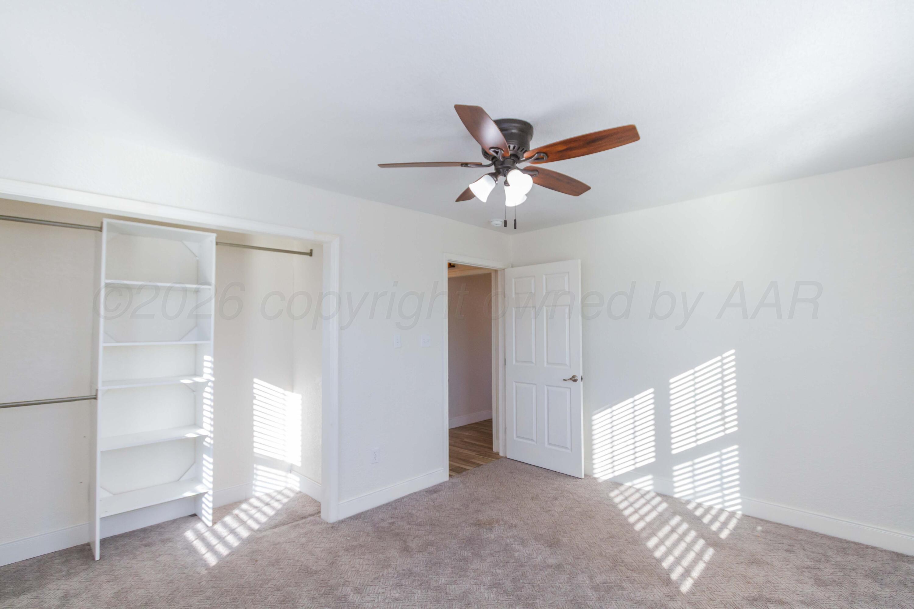 706 Pittsburg Street Amarillo, TX 79104 - Photo 13 of 22 a view of a livingroom with a chandelier fan