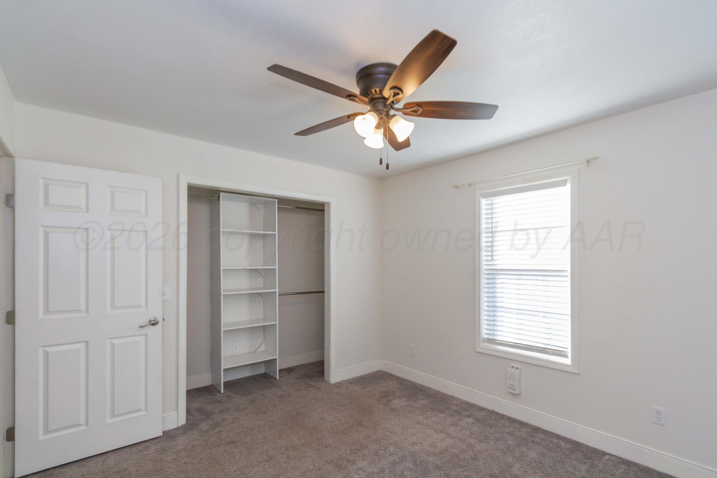 706 Pittsburg Street Amarillo, TX 79104 - Photo 17 of 22 a view of an empty room with a window