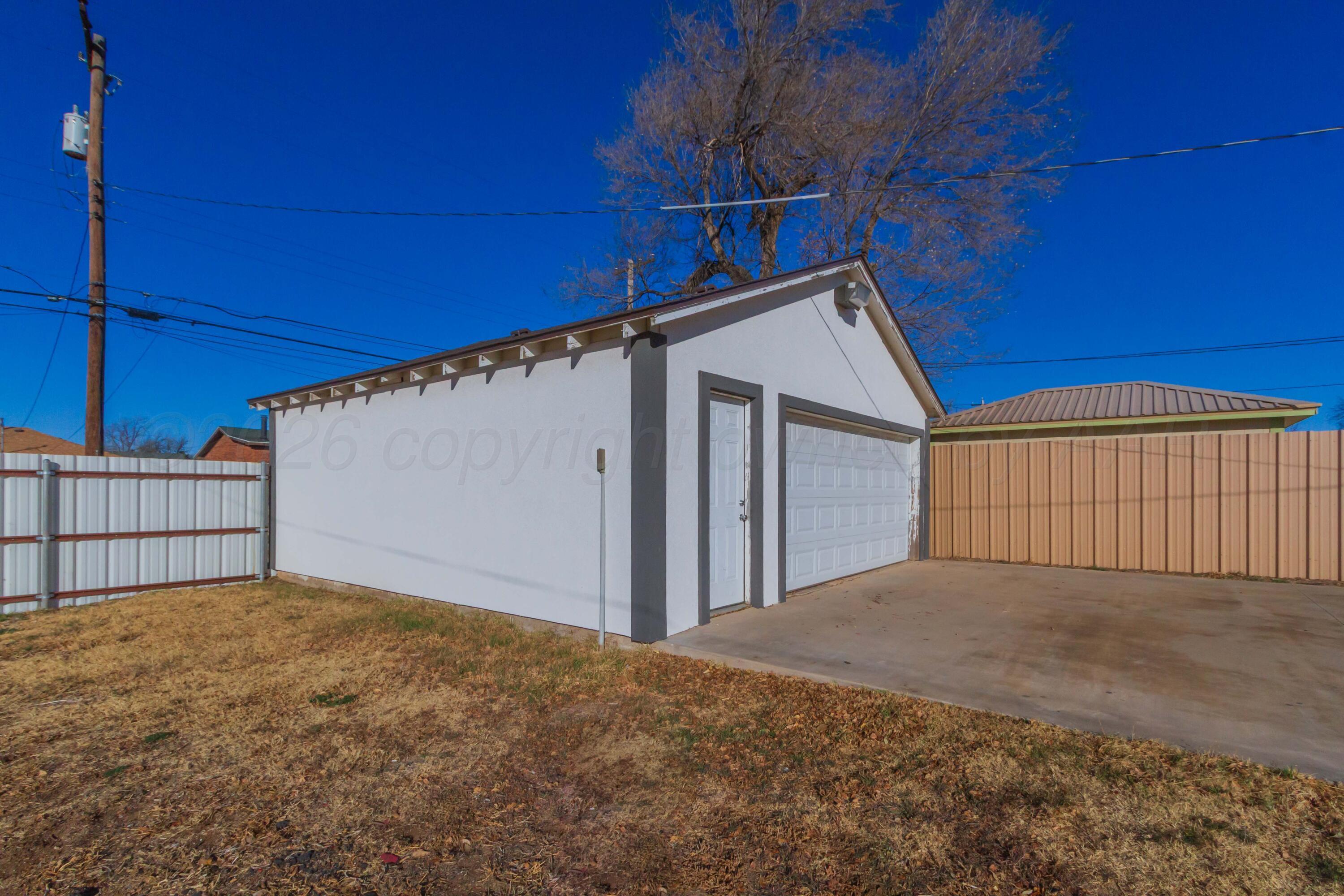 706 Pittsburg Street Amarillo, TX 79104 - Photo 19 of 22 a view of a house with a garage