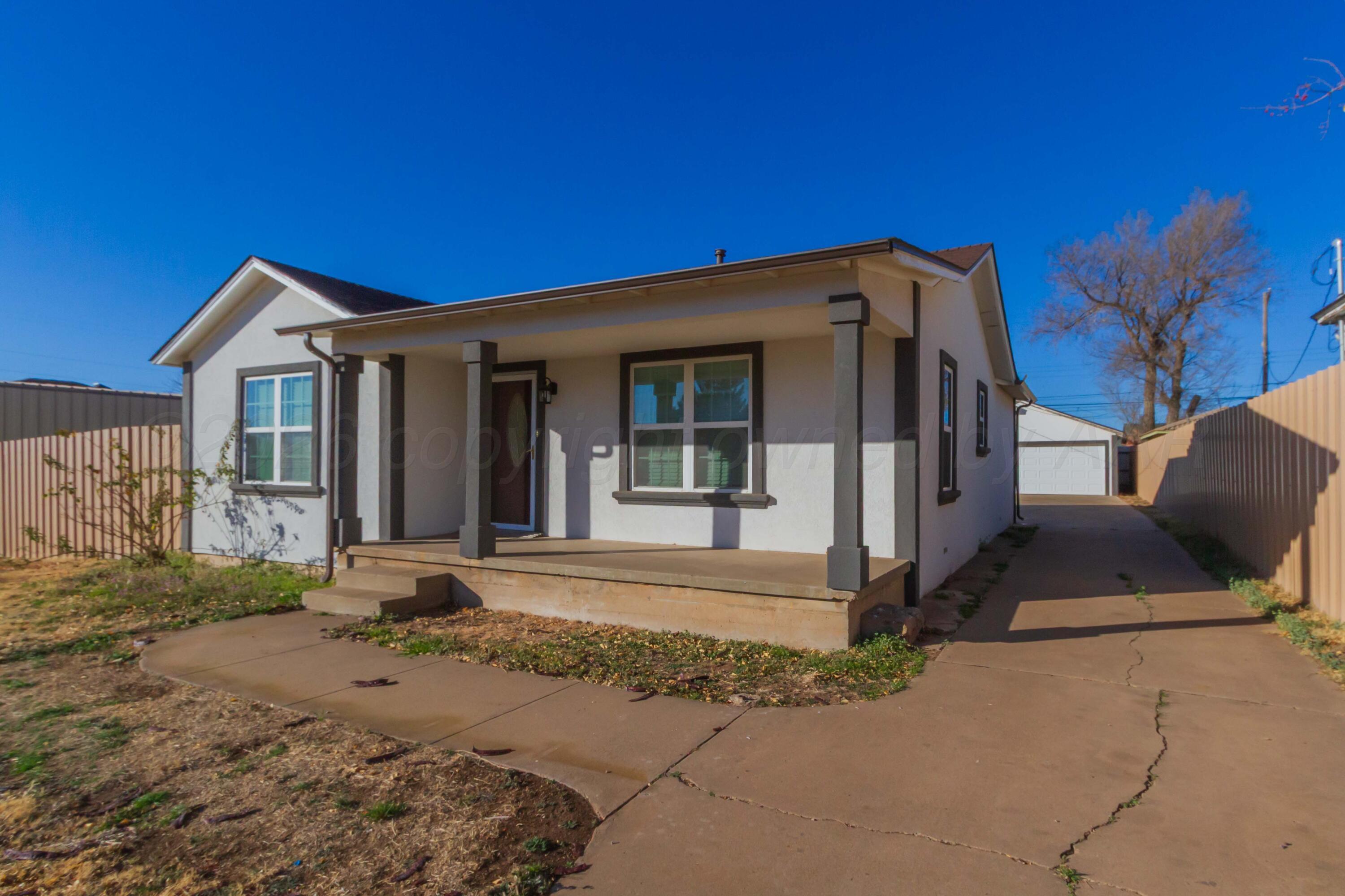 706 Pittsburg Street Amarillo, TX 79104 - Photo 2 of 22 a front view of a house with a yard