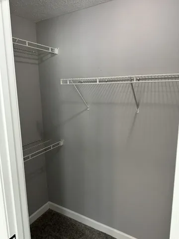 a view of a room with racks on the wall