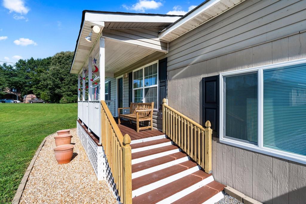 145 Milam Bridge Road Southwest Euharlee, GA 30120 - Photo 1 of 1 New railing of front porch. Steps designed for sensitive knees and joints. Protective screen under porch planks to protect from any flying insects.