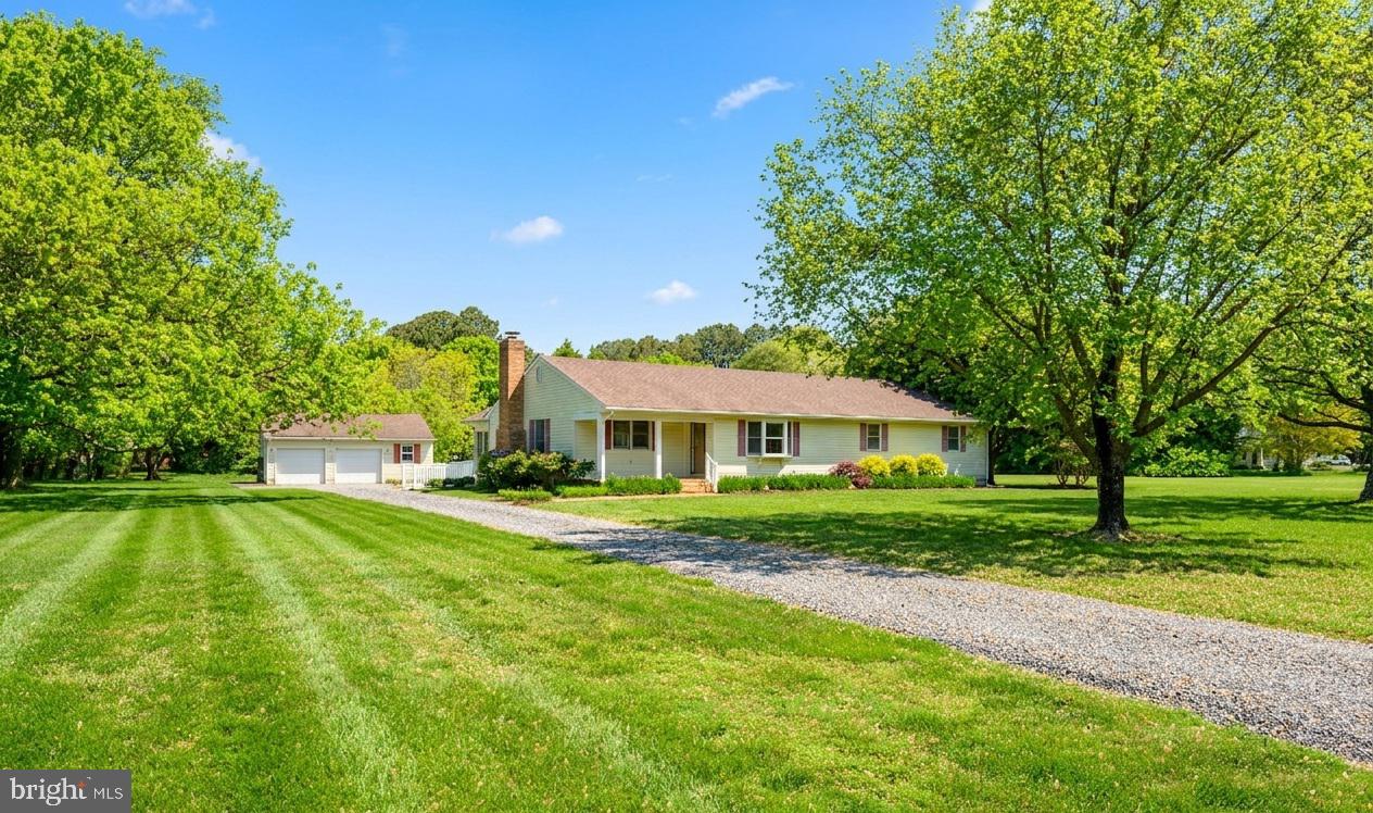 25714 Edgeview Road Royal Oak, MD 21662 - Photo 1 of 39 a front view of a house with a yard