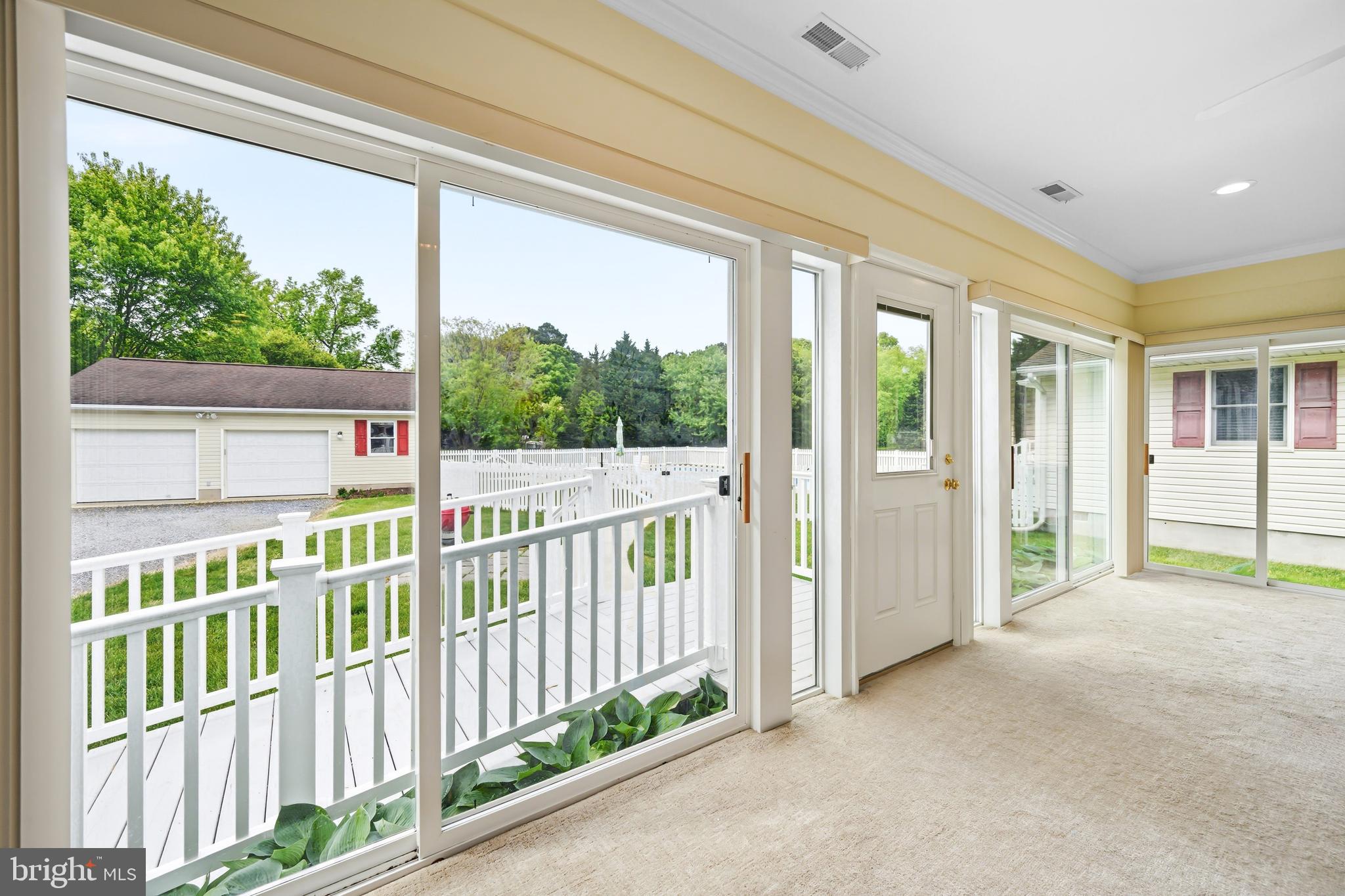 25714 Edgeview Road Royal Oak, MD 21662 - Photo 14 of 39 a view of a porch with wooden floor and fence