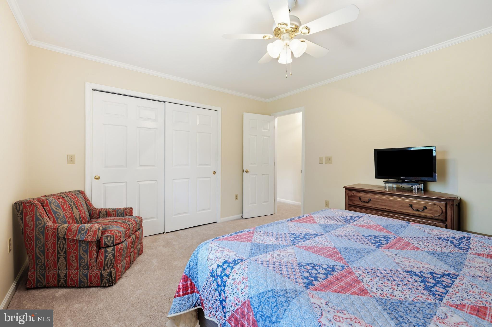 25714 Edgeview Road Royal Oak, MD 21662 - Photo 17 of 39 a bedroom with a bed and a television