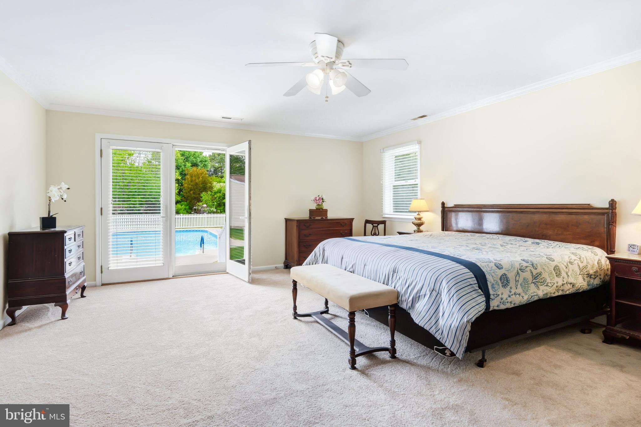 25714 Edgeview Road Royal Oak, MD 21662 - Photo 20 of 39 a spacious bedroom with a bed and a large window