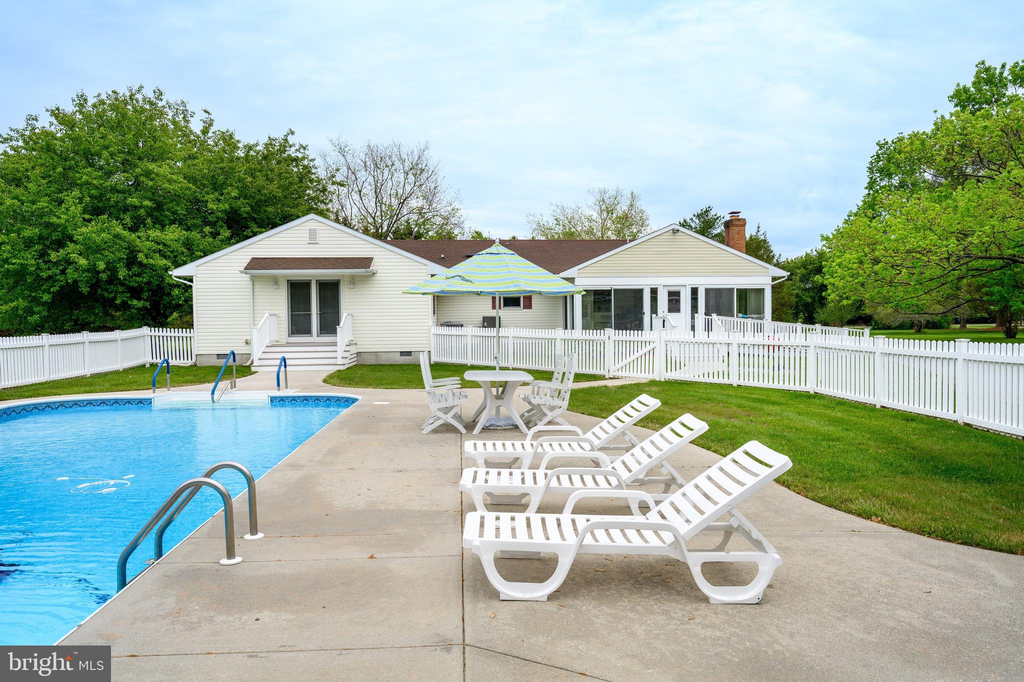 25714 Edgeview Road Royal Oak, MD 21662 - Photo 28 of 39 a view of a house with swimming pool and sitting area