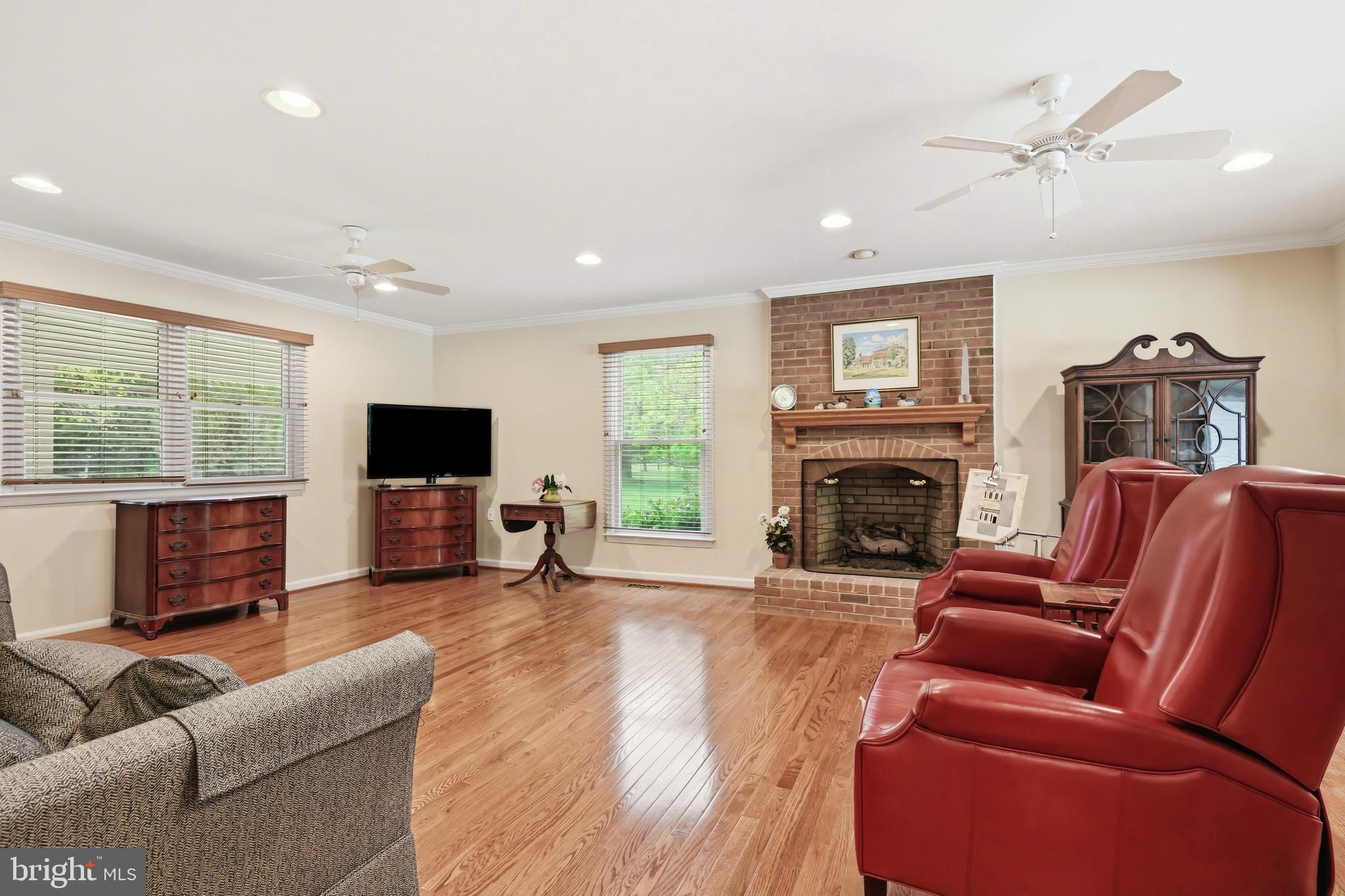 25714 Edgeview Road Royal Oak, MD 21662 - Photo 5 of 39 a living room with furniture a flat screen tv and a fireplace