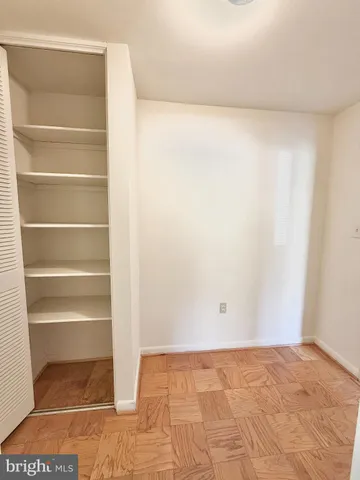 an empty room with a empty space and windows